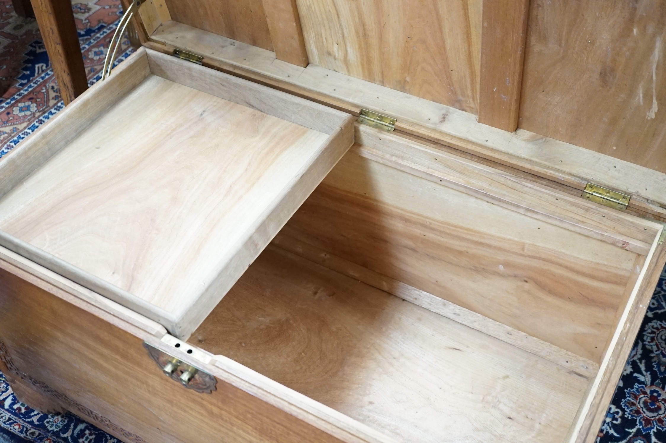 A Chinese carved camphorwood chest, width 97cm *Please note the sale commences at 9am.